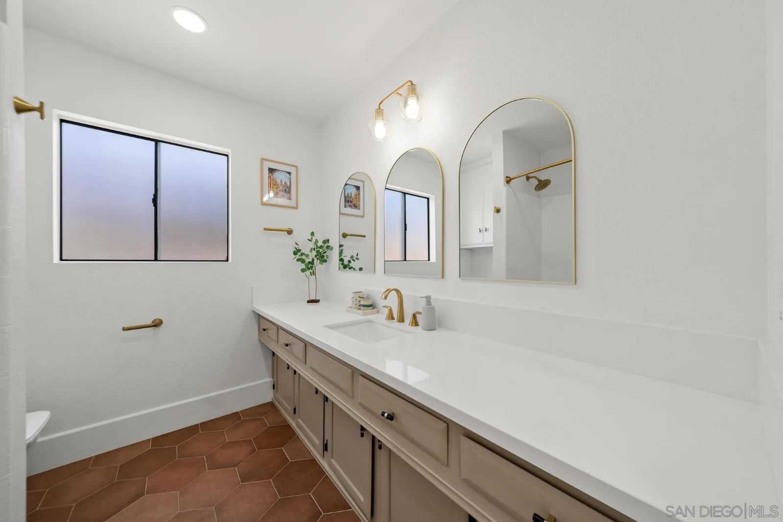 4010 Corral Canyon Road Bonita, CA 91902 - Photo 22 of 35 a bathroom with a double vanity sink and a mirror