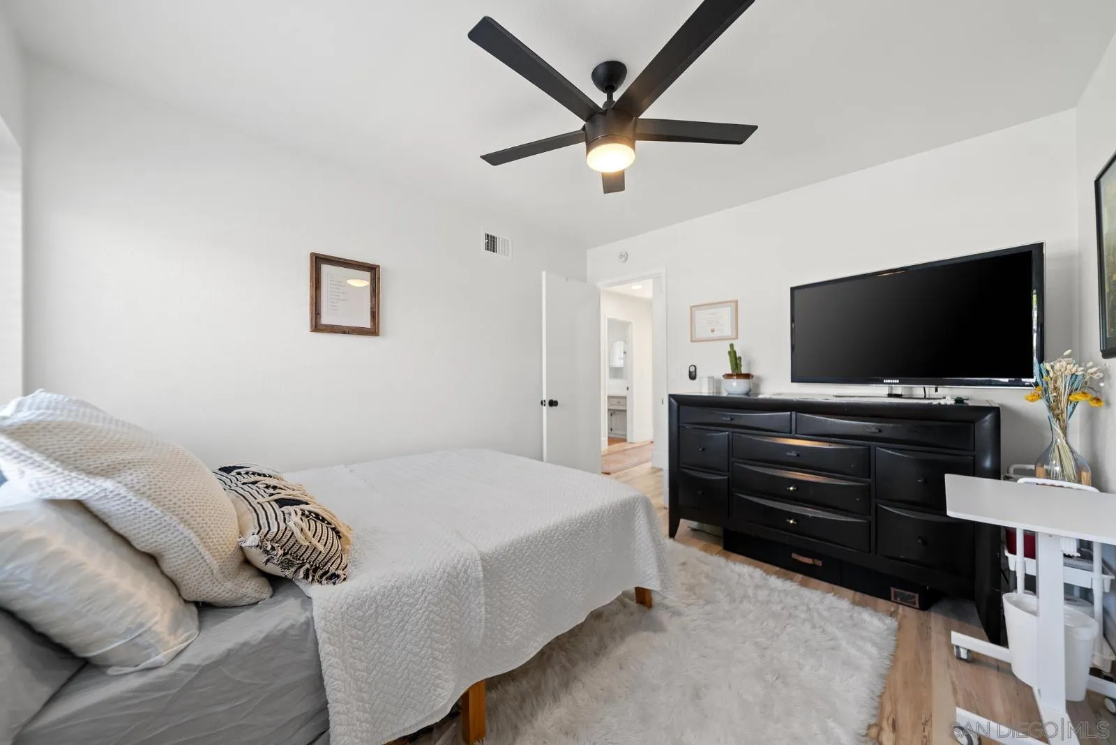 4010 Corral Canyon Road Bonita, CA 91902 - Photo 23 of 35 a bedroom with a bed and a flat screen tv