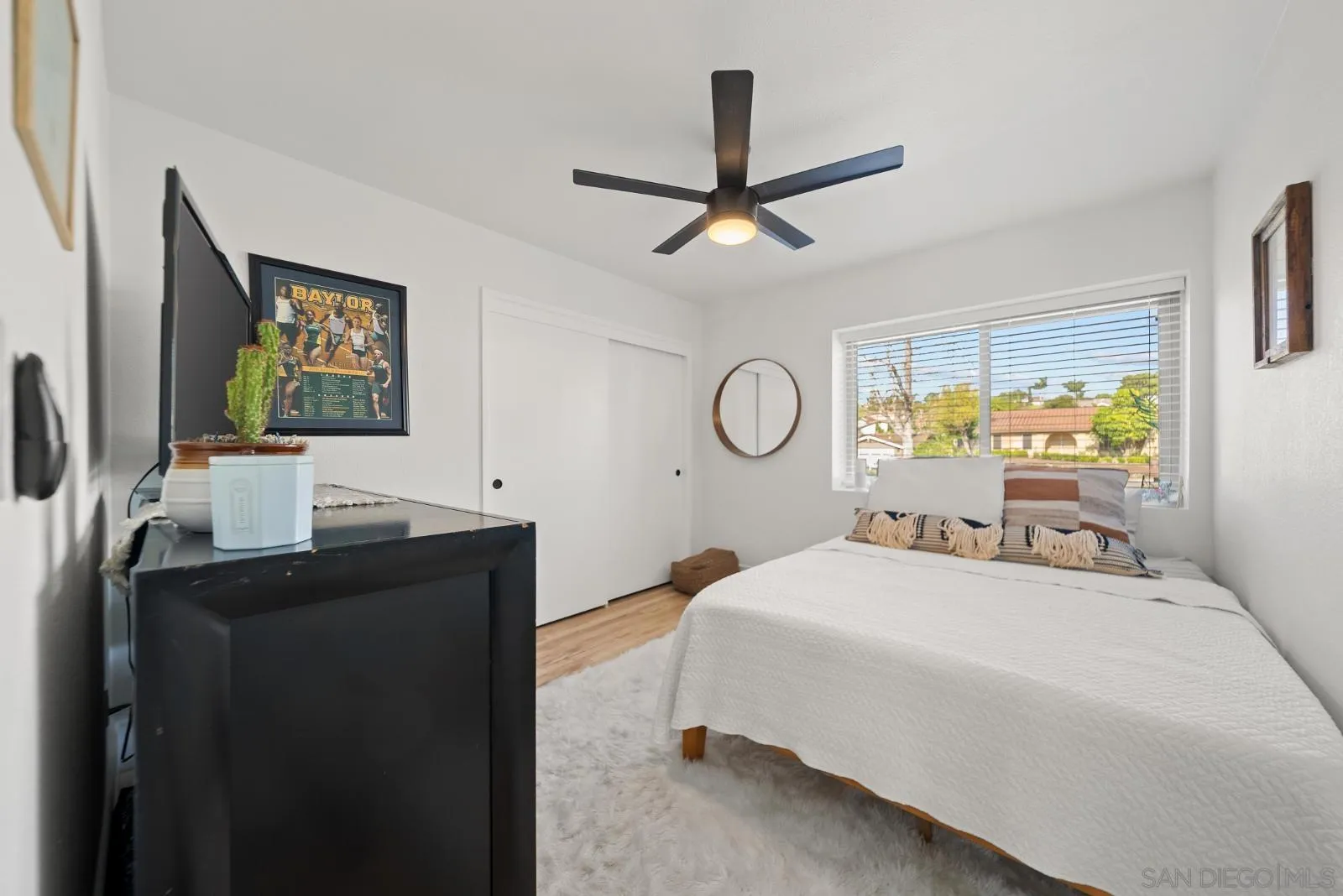 4010 Corral Canyon Road Bonita, CA 91902 - Photo 24 of 35 a bedroom with a bed and dresser with mirror
