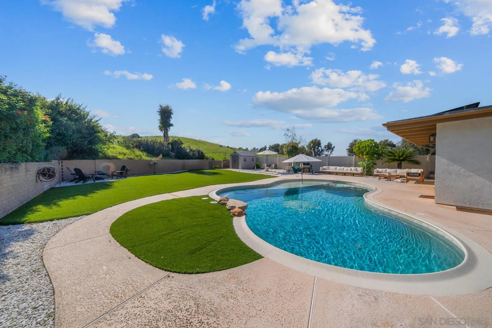 4010 Corral Canyon Road Bonita, CA 91902 - Photo 28 of 35 a view of a swimming pool with a yard