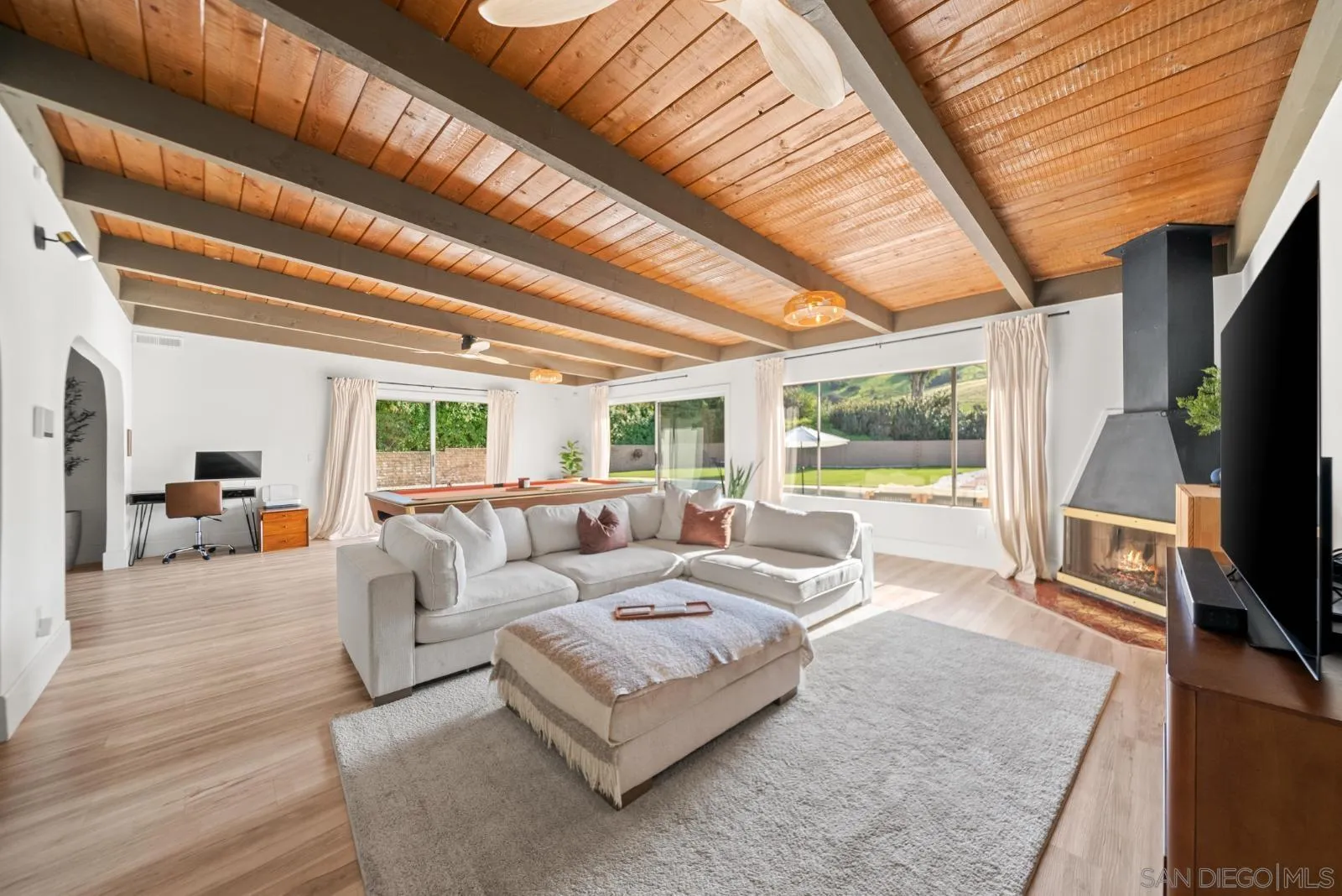 4010 Corral Canyon Road Bonita, CA 91902 - Photo 8 of 35 a living room with furniture a flat screen tv and a large window