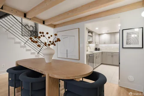 a view of kitchen with furniture and wooden floor