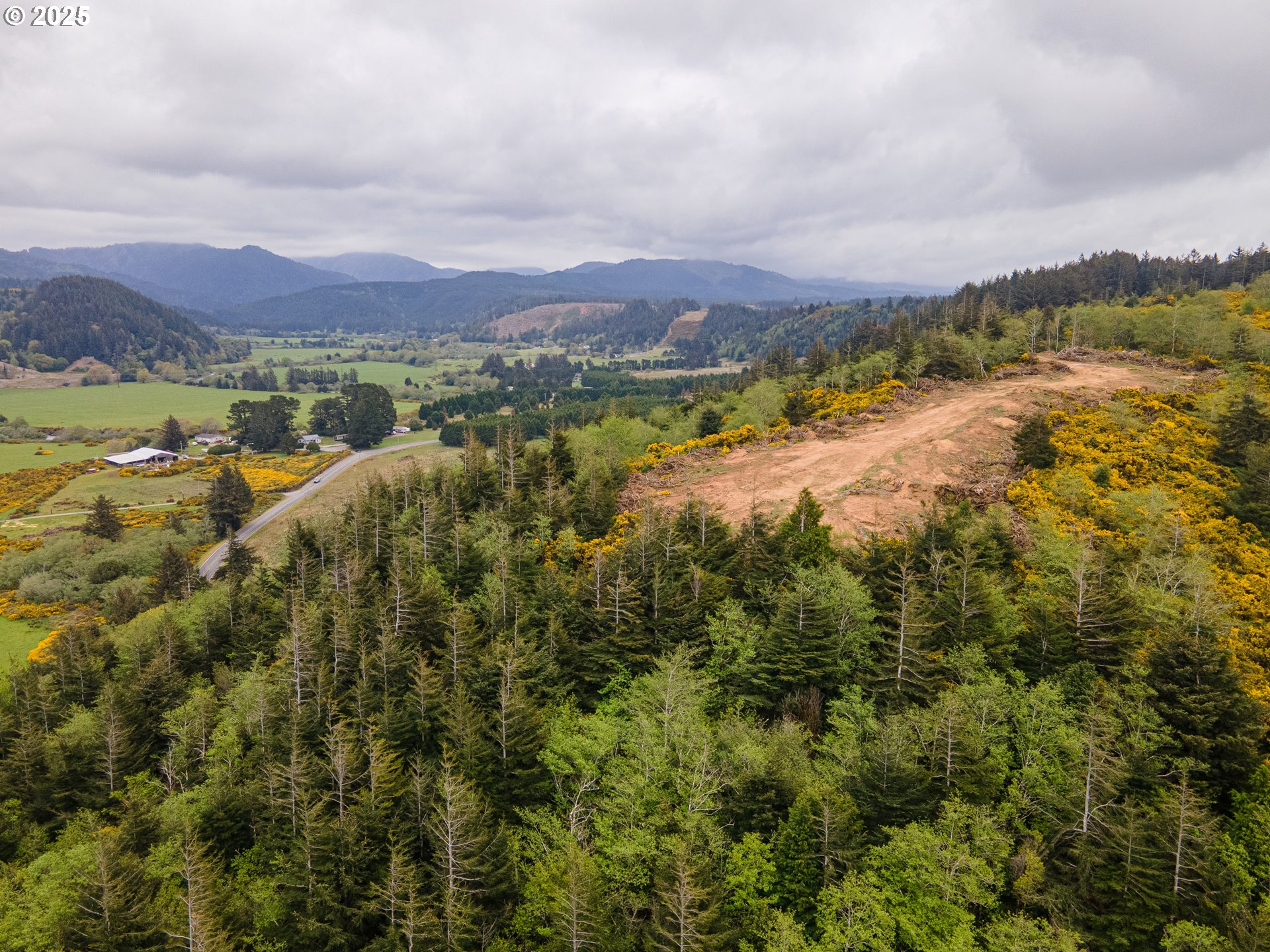 Elk River Road Port Orford, OR 97465 - Photo 11 of 22 a view of a city with mountains in the background