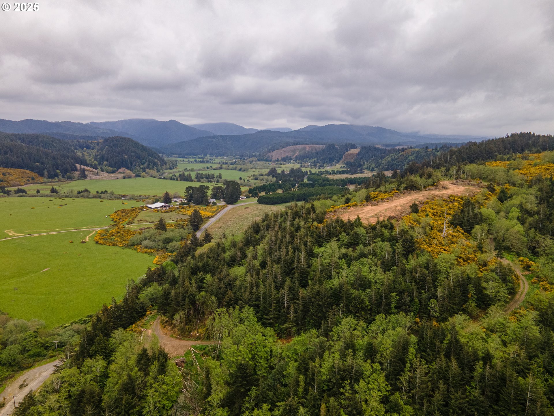 Elk River Road Port Orford, OR 97465 - Photo 15 of 22 a view of a city with an ocean