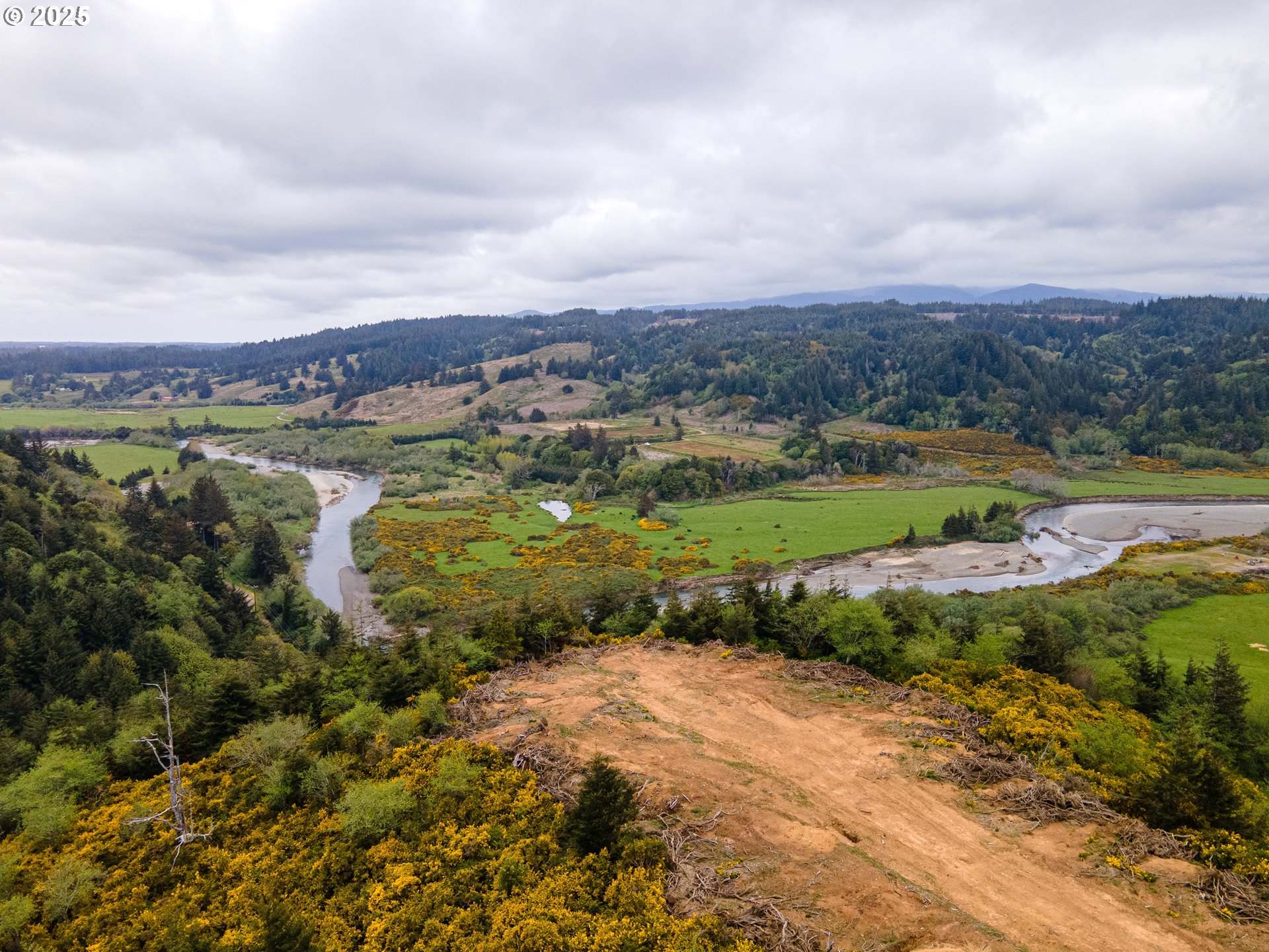 Elk River Road Port Orford, OR 97465 - Photo 9 of 22 a view of a lake with mountains in the background