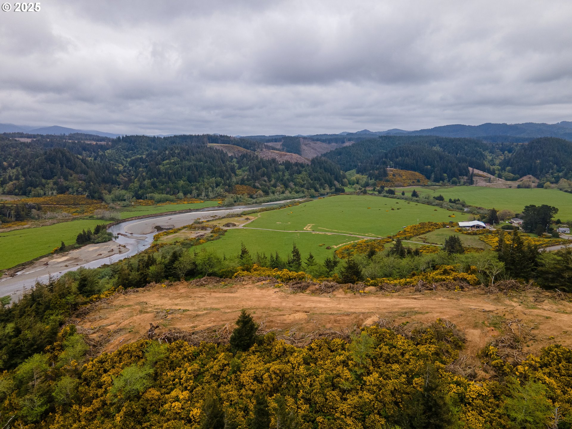 Elk River Road Port Orford, OR 97465 - Photo 10 of 22 an aerial view of a golf course with a lake view
