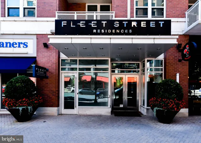 a living room with furniture and a large mirror