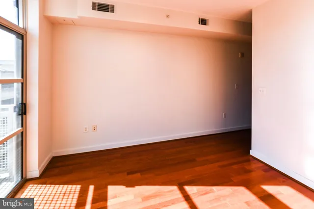 a kitchen with granite countertop stainless steel appliances and wooden cabinets