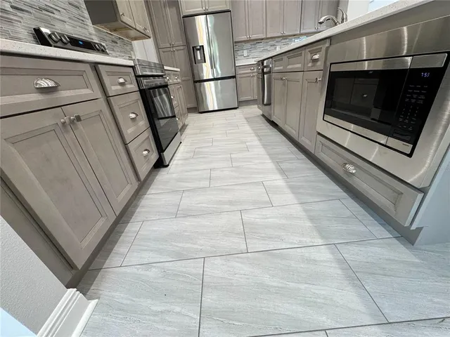 a bathroom with a toilet and a bath tub