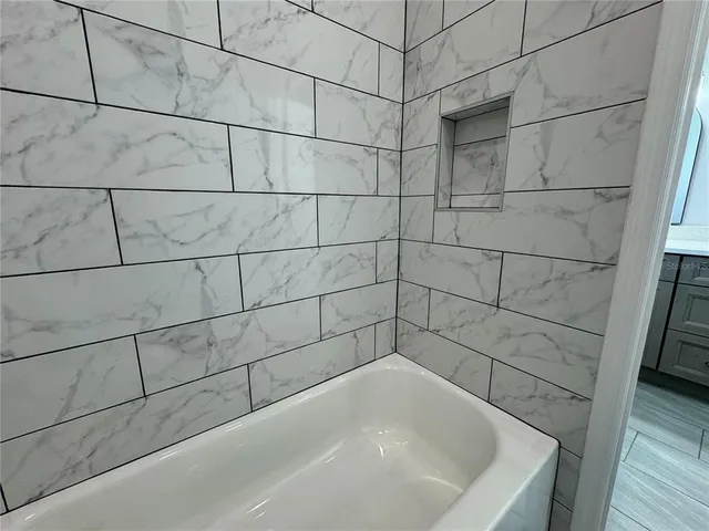 an aerial view of a house with swimming pool