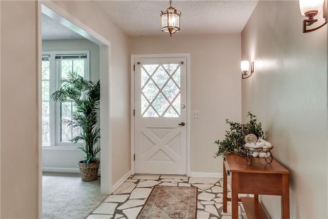 Lovely Front Foyer opens to formal areas and den!