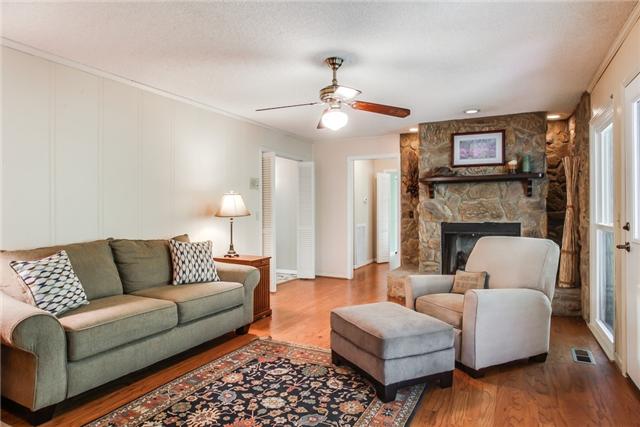 Family Room overlooks covered deck and fenced backyard!
