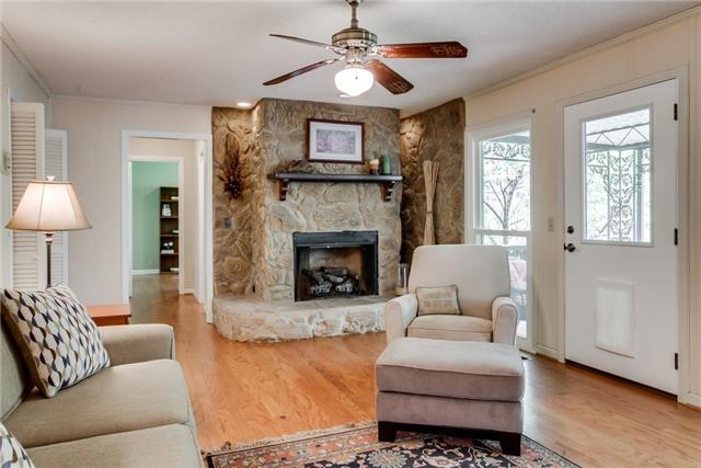 Another shot of Family Room with stone hearth and fireplace