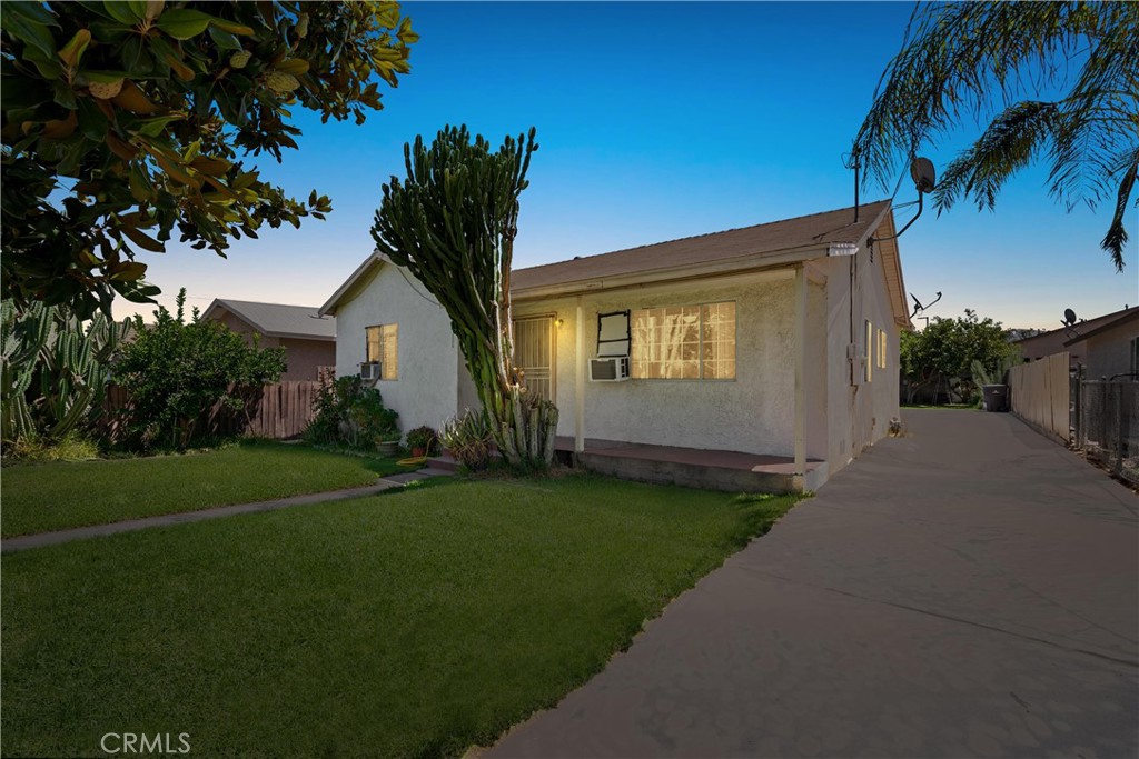 4326 Langston Place Riverside, CA 92507 - Photo 1 of 1 a front view of house with yard and green space