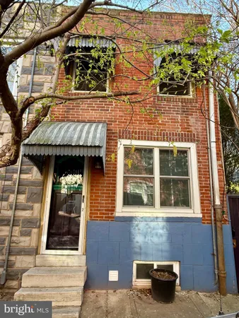 a view of a brick house with an outdoor space