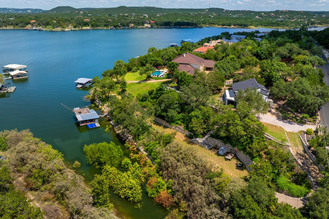 a aerial view of a houses with a lake view