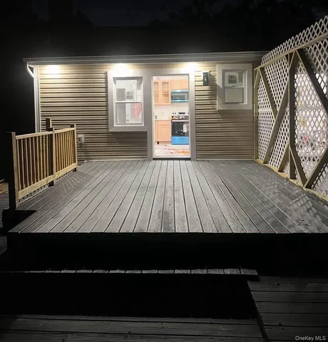 a view of outdoor space with wooden floor