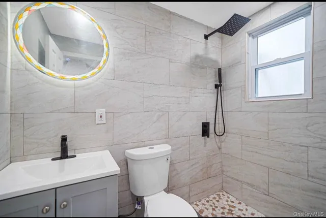 a bathroom with a toilet and a sink