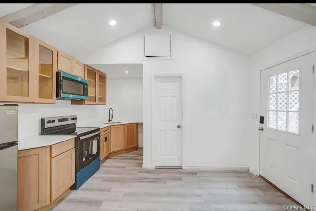 a kitchen with stainless steel appliances granite countertop a stove and a sink