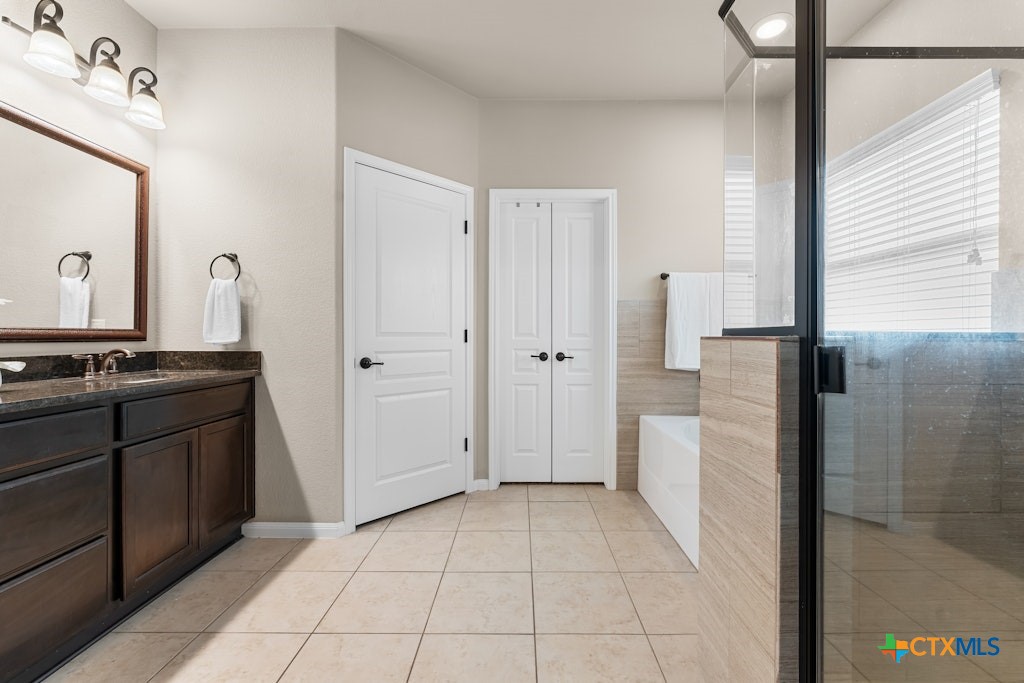 430 Archstone Loop Belton, TX 76513 - Photo 17 of 40 a bathroom with a granite countertop sink a toilet and a mirror