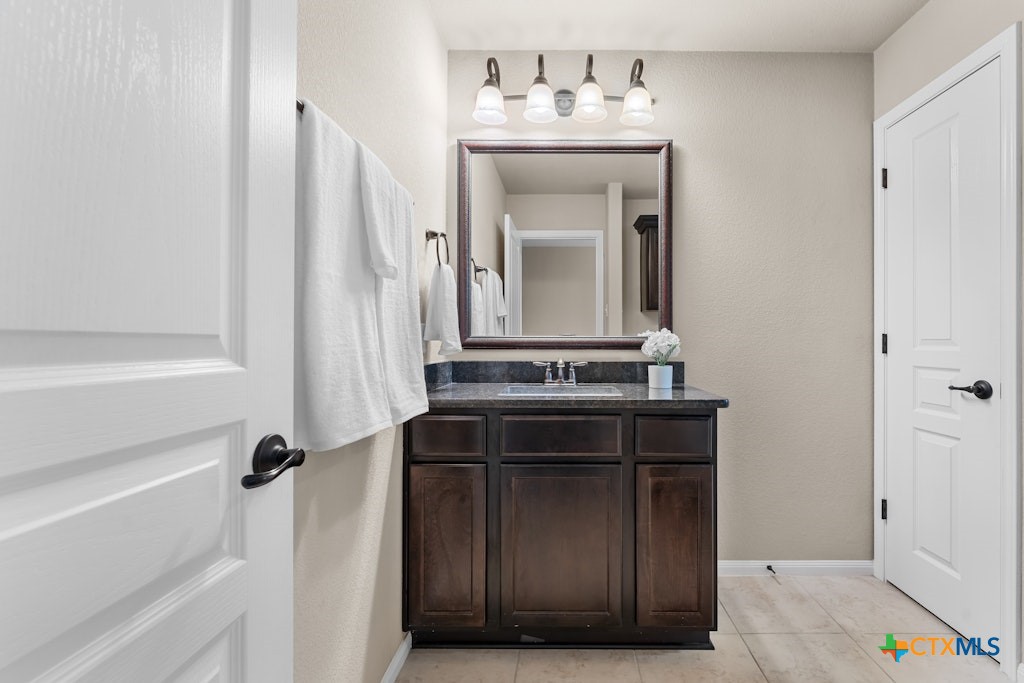 430 Archstone Loop Belton, TX 76513 - Photo 27 of 40 a bathroom with a sink and a mirror