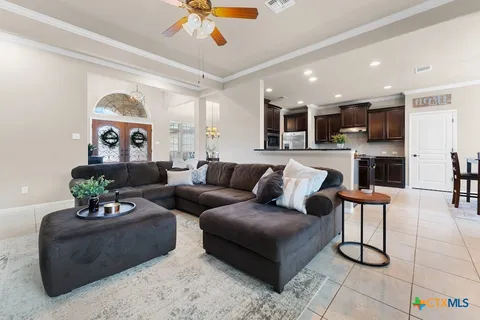 a living room with furniture and a large window
