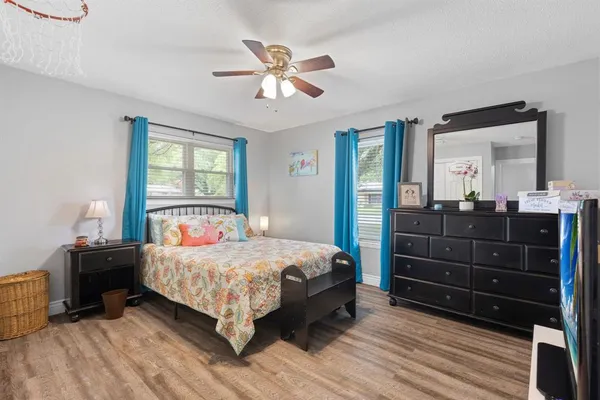 a bedroom with a bed and a dresser