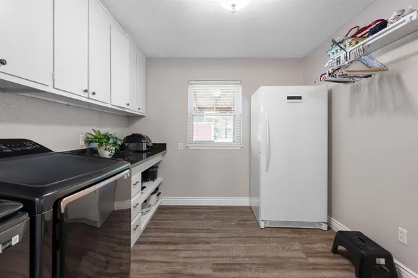 a kitchen with stainless steel appliances a stove a sink and a refrigerator