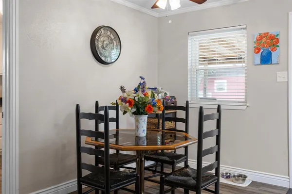 a dining room with furniture and window