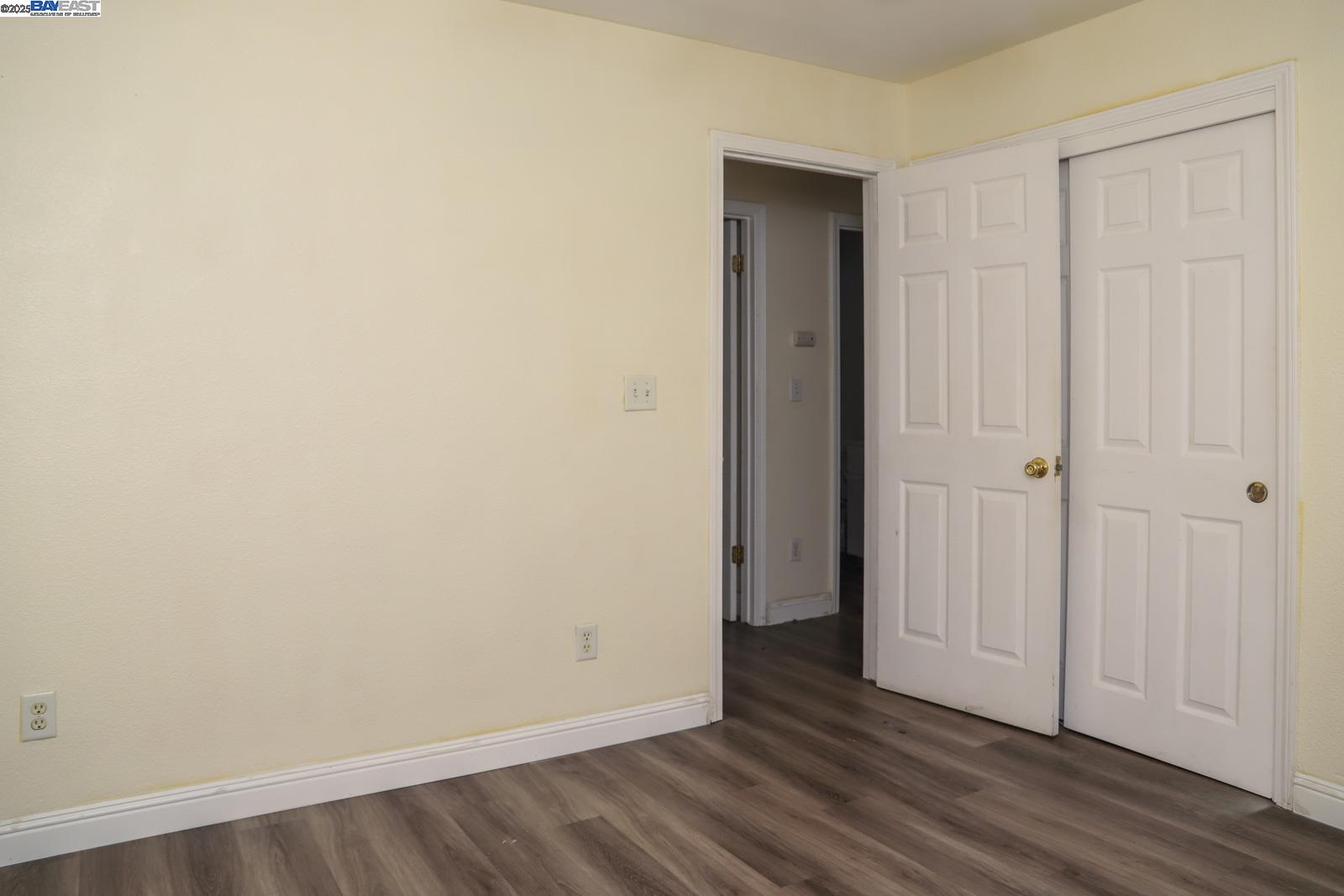 4295 North Archie Avenue Fresno, CA 93726 - Photo 12 of 23 a view of an empty room with wooden floor