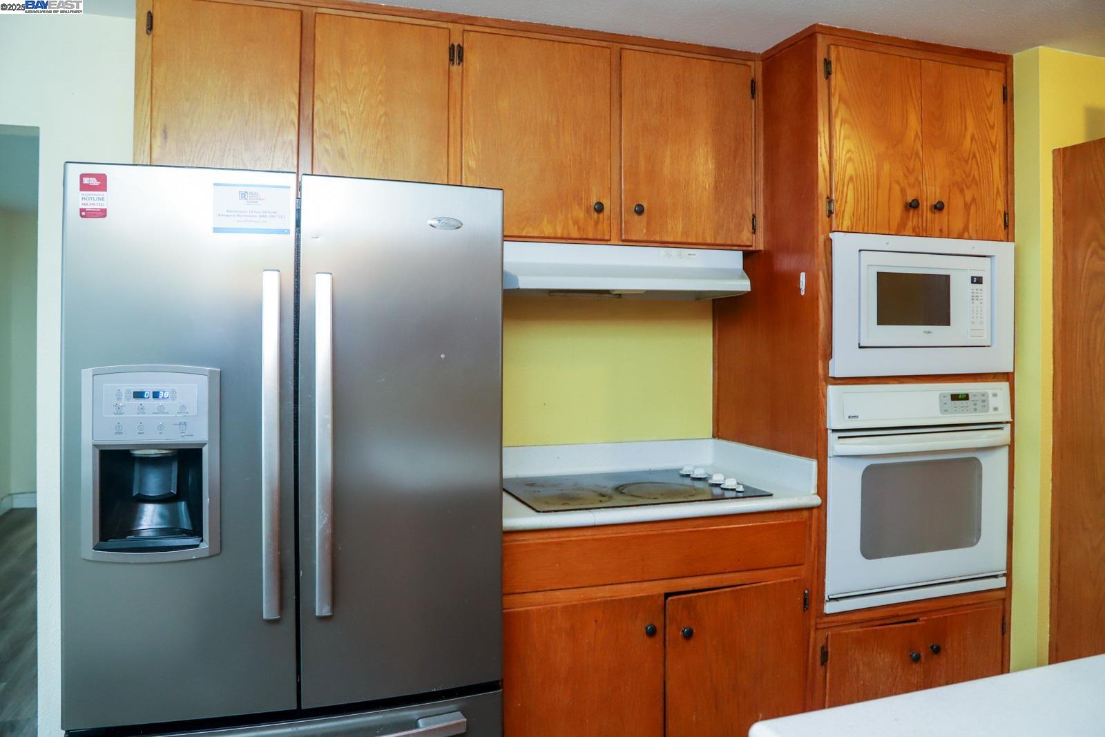 4295 North Archie Avenue Fresno, CA 93726 - Photo 15 of 23 a kitchen with stainless steel appliances granite countertop a refrigerator and a stove