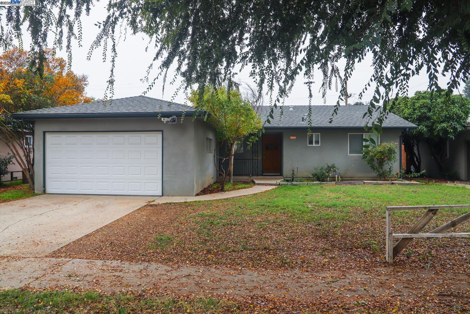 4295 North Archie Avenue Fresno, CA 93726 - Photo 2 of 23 a front view of a house with garden