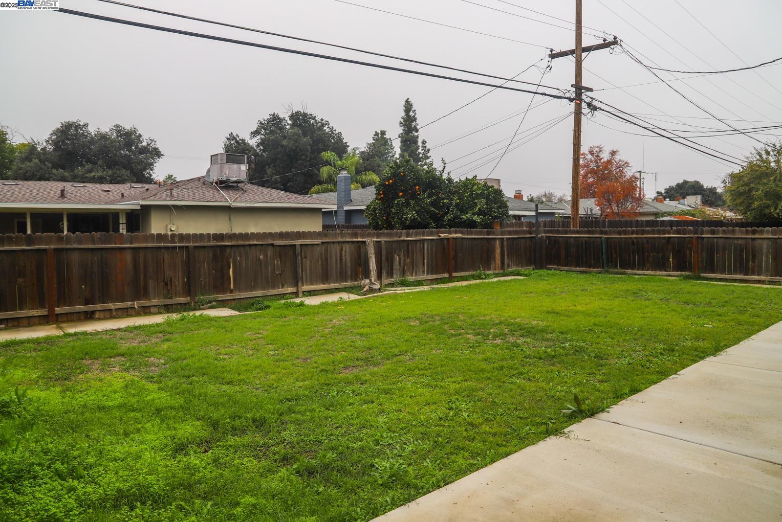 4295 North Archie Avenue Fresno, CA 93726 - Photo 22 of 23 a house view with swimming pool in front of it