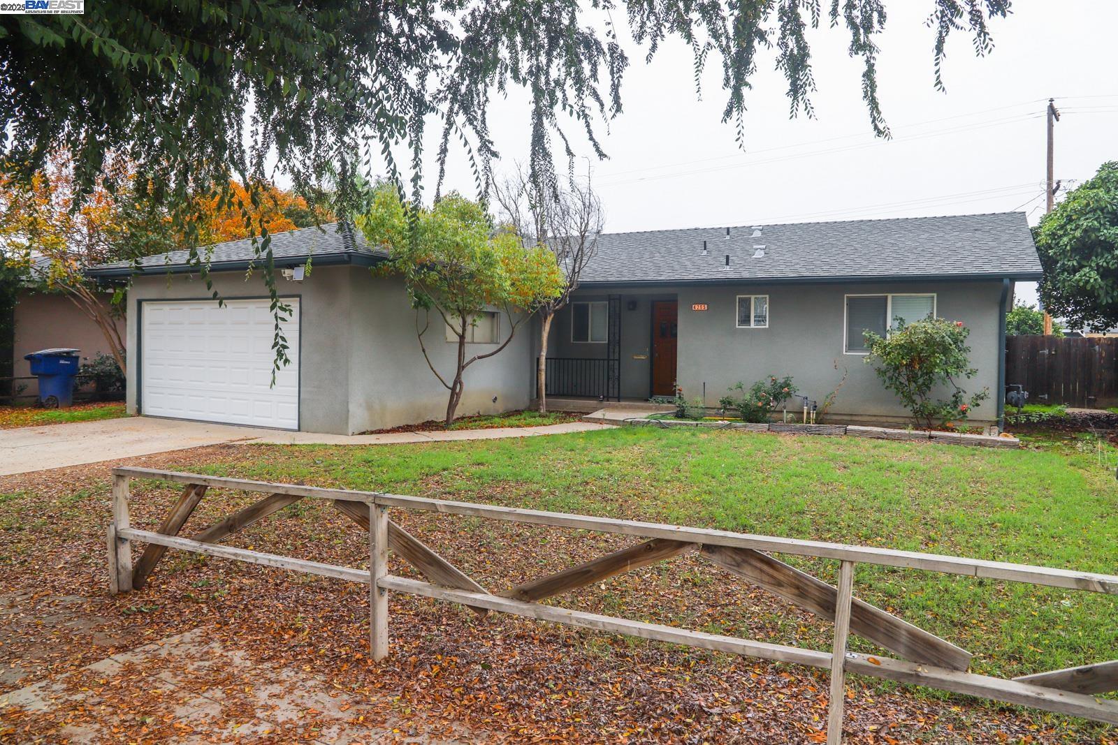 4295 North Archie Avenue Fresno, CA 93726 - Photo 3 of 23 a front view of a house with garden