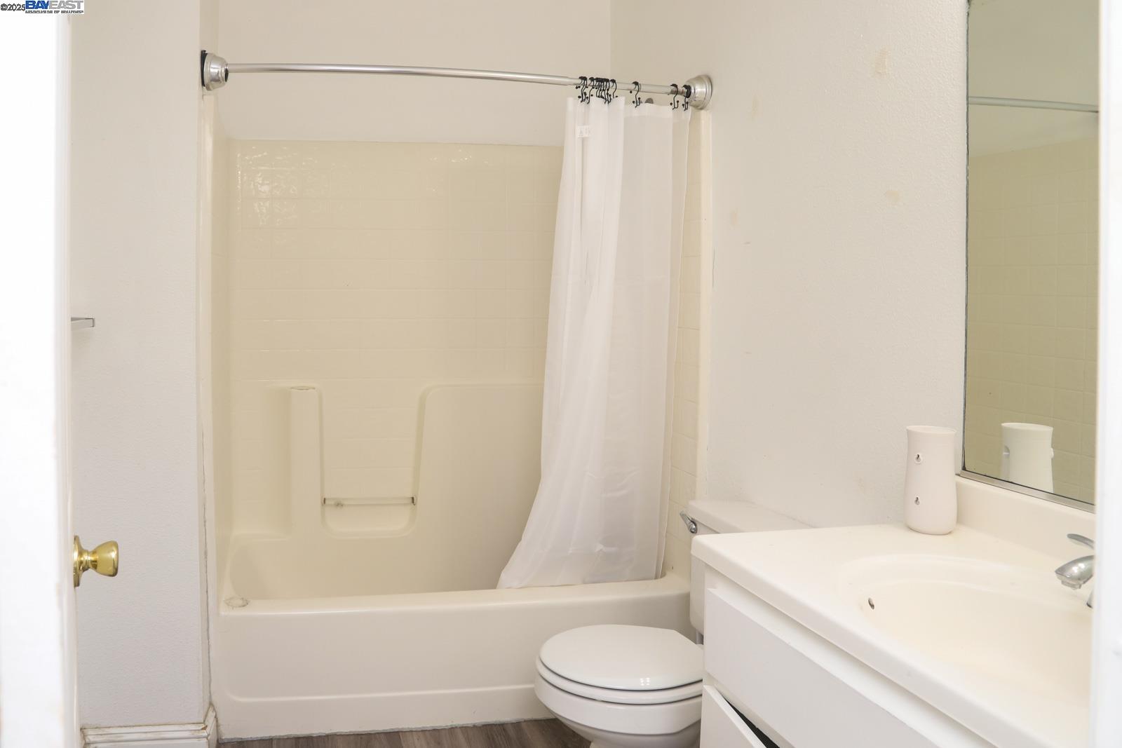 4295 North Archie Avenue Fresno, CA 93726 - Photo 4 of 23 a white toilet sitting next to a bath tub