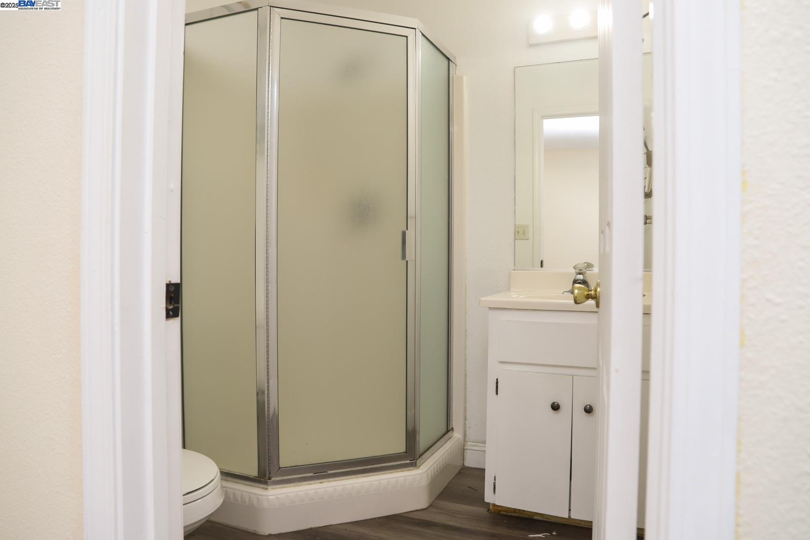4295 North Archie Avenue Fresno, CA 93726 - Photo 8 of 23 a bathroom with a shower and a sink