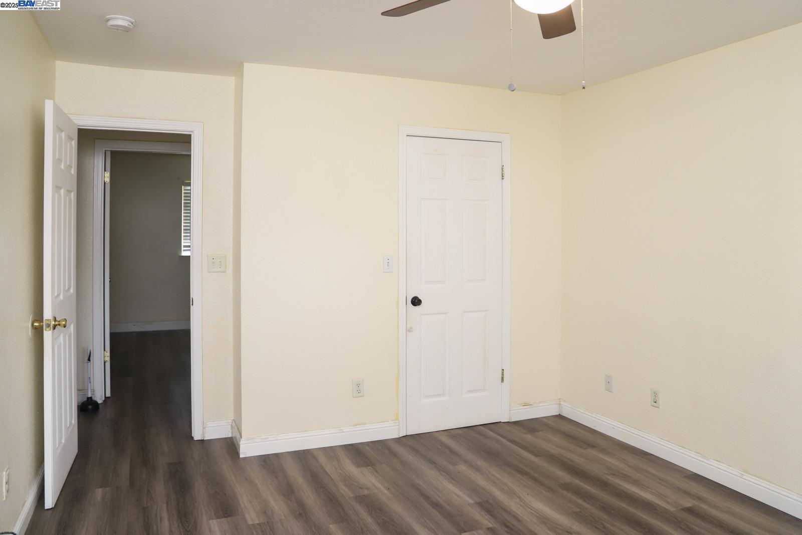 4295 North Archie Avenue Fresno, CA 93726 - Photo 9 of 23 an empty room with wooden floor