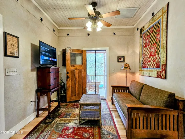 a living room with furniture and a flat screen tv