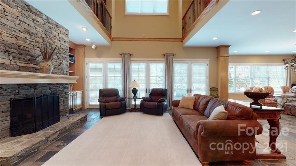 1755 St Johns Church Road Concord, NC 28025 - Photo 11 of 41 a living room with furniture and a fireplace