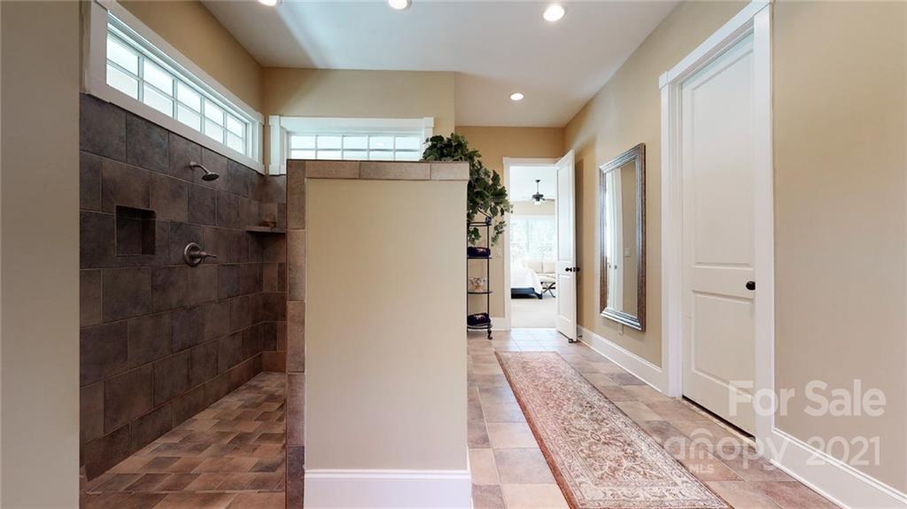 1755 St Johns Church Road Concord, NC 28025 - Photo 23 of 41 a bathroom with a shower and a glass door