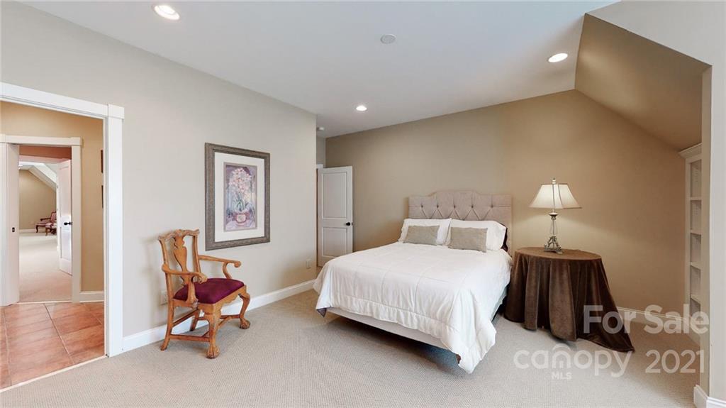 1755 St Johns Church Road Concord, NC 28025 - Photo 29 of 41 a bedroom with a bed a table and chair