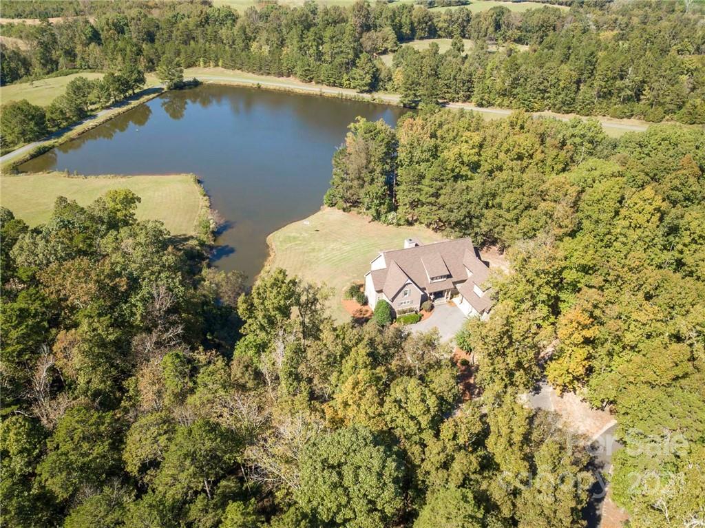 1755 St Johns Church Road Concord, NC 28025 - Photo 39 of 41 an aerial view of a house with a yard and lake view