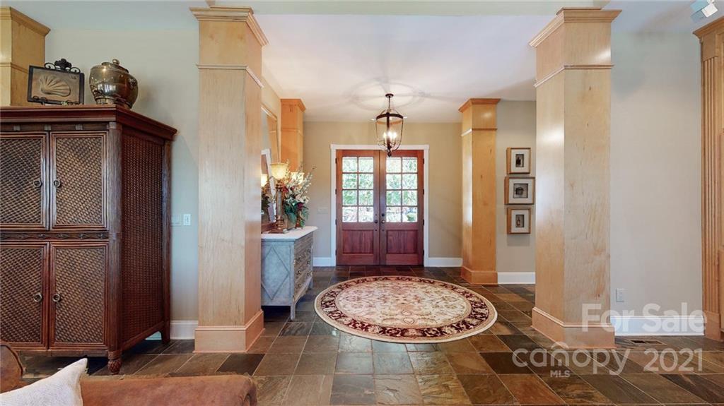 1755 St Johns Church Road Concord, NC 28025 - Photo 7 of 41 a view of a livingroom with a dinning table and chair