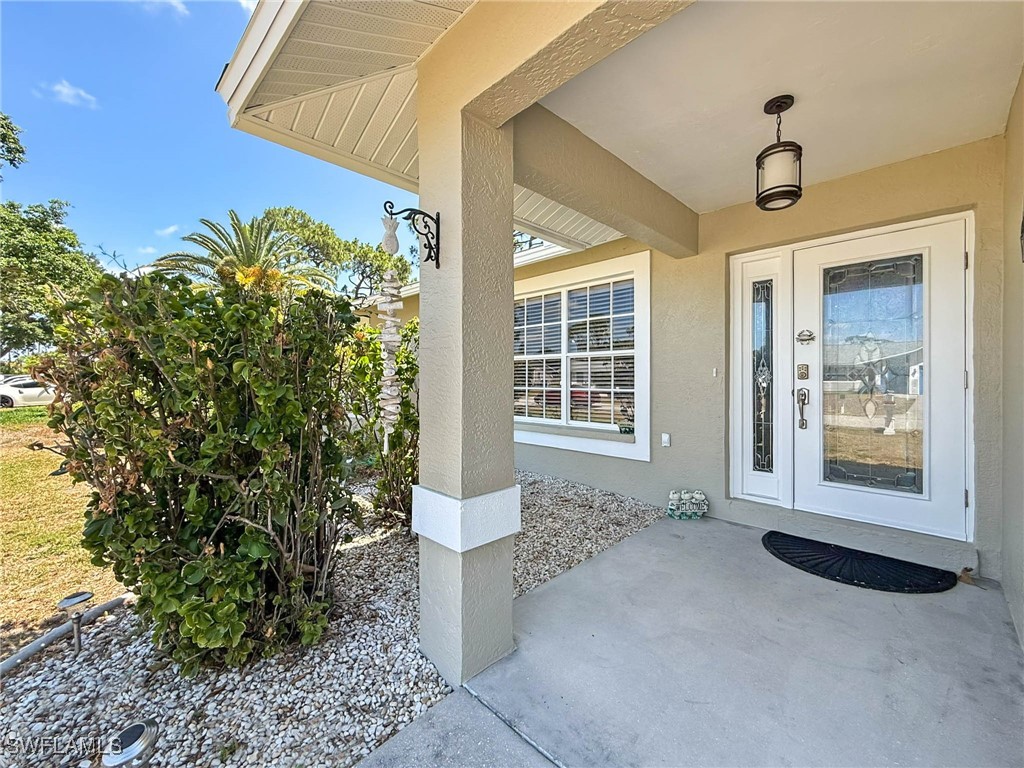 18237 Apple Road Fort Myers, FL 33967 - Photo 3 of 30 a front view of a house with a yard