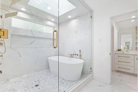 a bathroom with a bathtub and shower