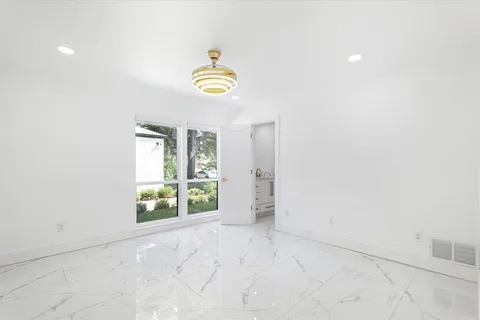 a bathroom with a shower and toilet