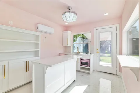 a kitchen with a stove and a microwave