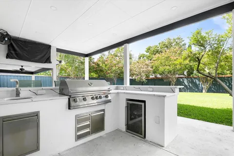a view of a house with a yard and sitting area
