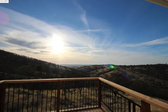 a view of city and sky from a balcony