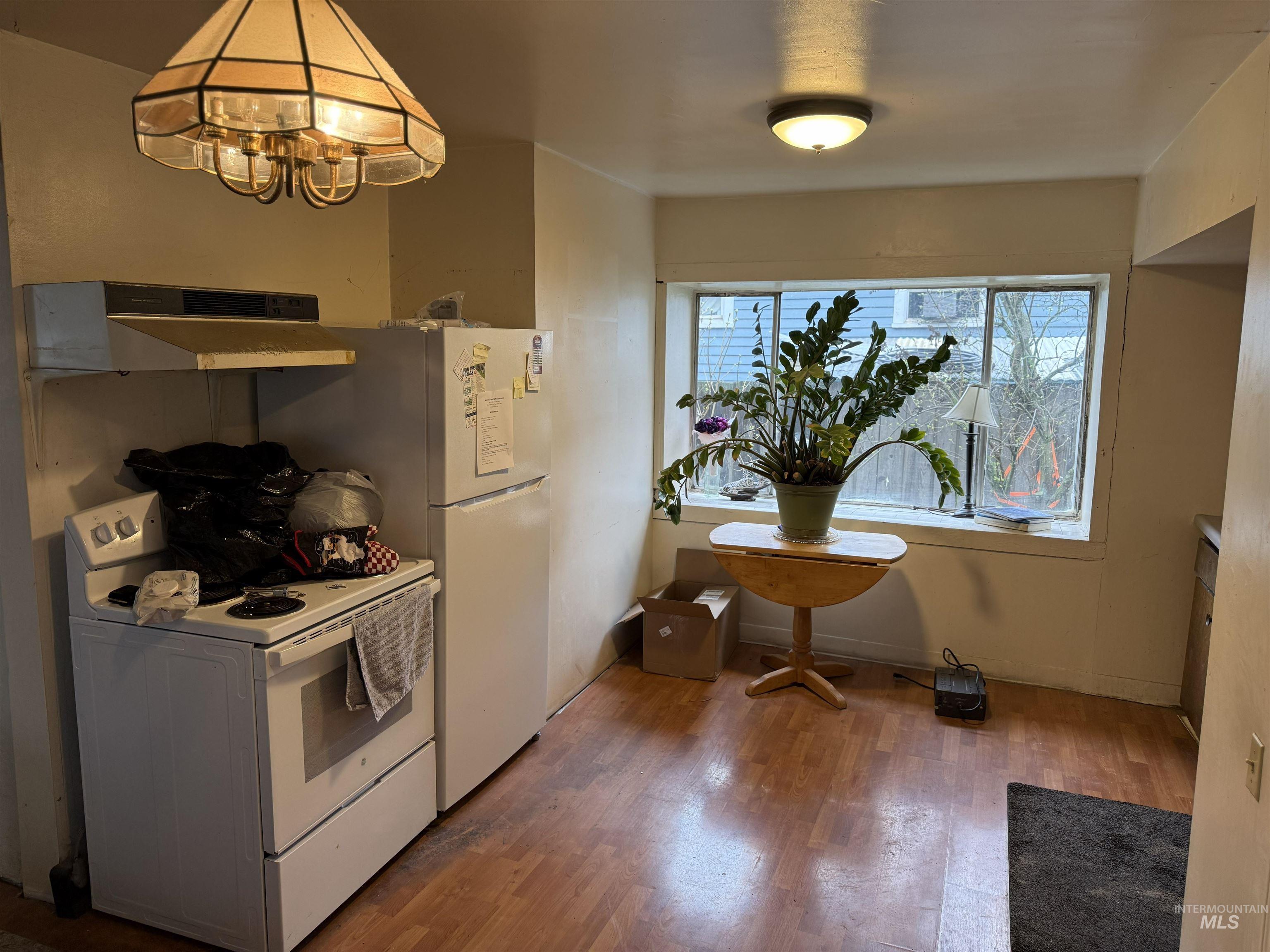 838 11th Street Clarkston, WA 99403 - Photo 2 of 20 Kitchen featuring white electric range and dark wood finished floors